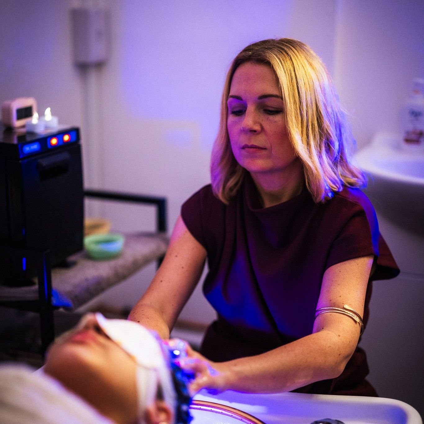 Stacey at work in violet light